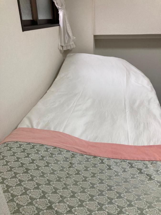 Eenpersoonskamer met Gedeelde Badkamer en Toilet